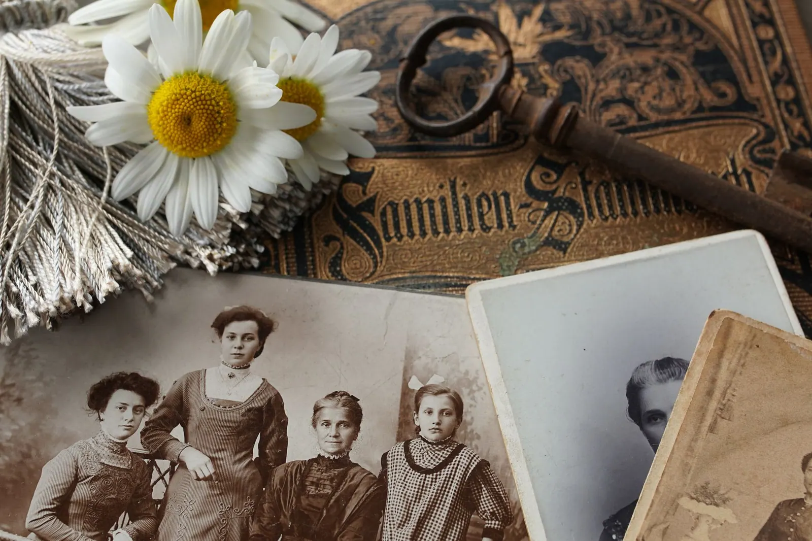 Vintage family photographs with daisies and an antique key evoke memories and nostalgia. What to know about people by heritage directory, and why it matters