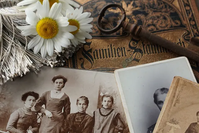 Vintage family photographs with daisies and an antique key evoke memories and nostalgia. What to know about people by heritage directory, and why it matters