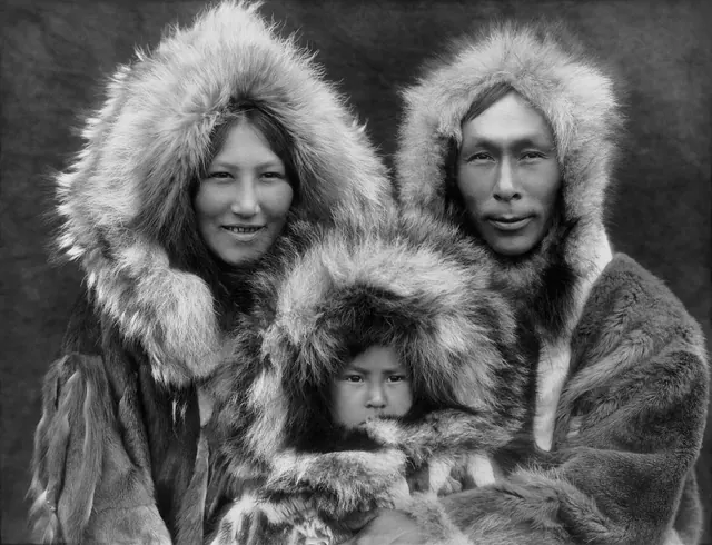 A family portrait of an Inupiat Eskimo mother, father, and son. Photographed in Noatak, Alaska, circa 1929. From The North American Indian, by Edward S. Curtis. The scan was made f. People by US city by country: a country-by-country directory